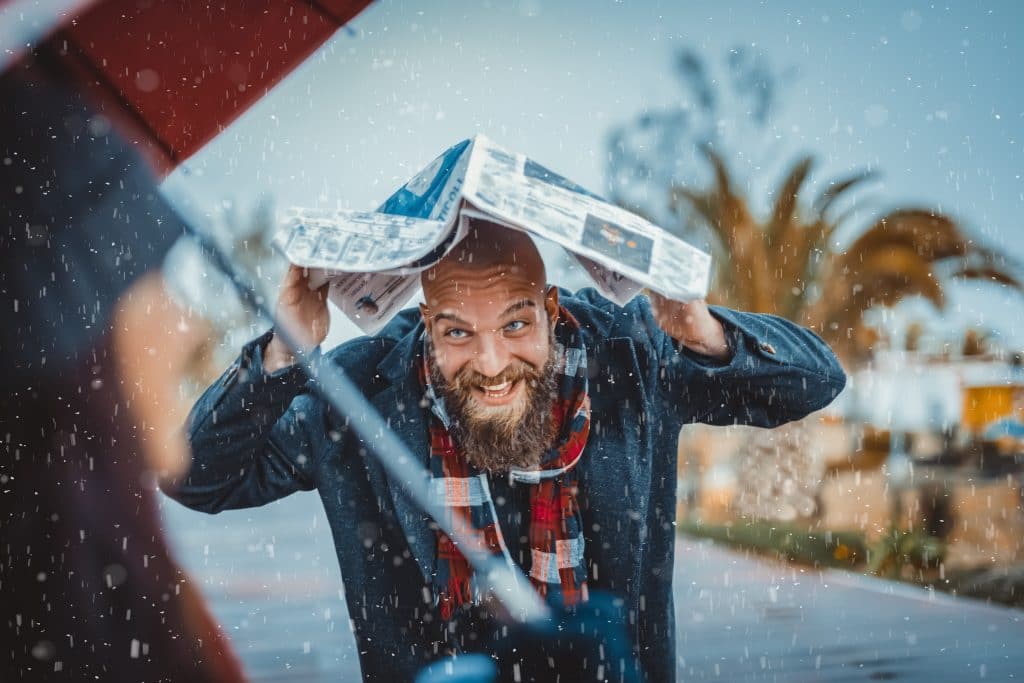 bearded and bald guy stuck in the rain