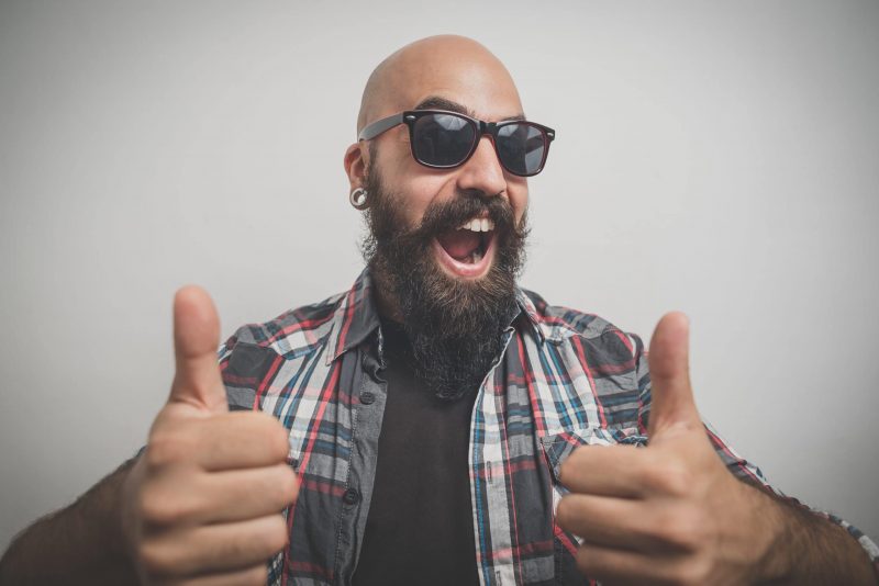 bald guy with a beard dressed casually