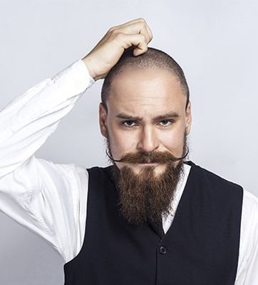 bald man with moustache and beard