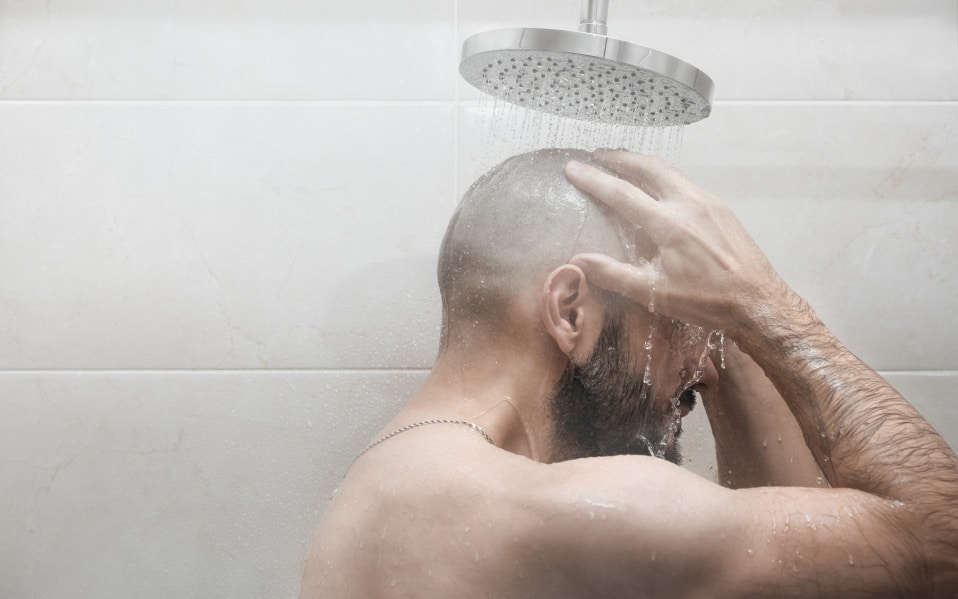 bald-guy-hair-loss-shower-products-shampoo